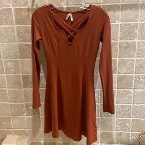 woman’s long sleeve dress with open chest design
